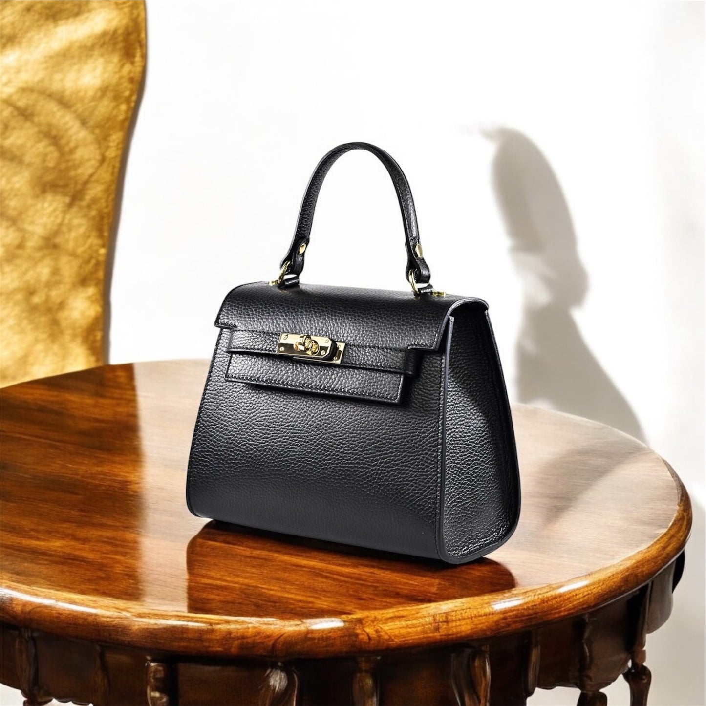 Borsa a mano e tracolla in pelle martellata